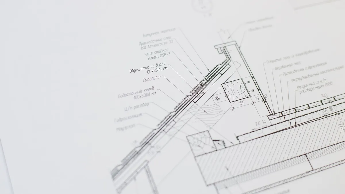 Close-up of a detailed architectural floor plan focusing on technical elements and design specifications.
