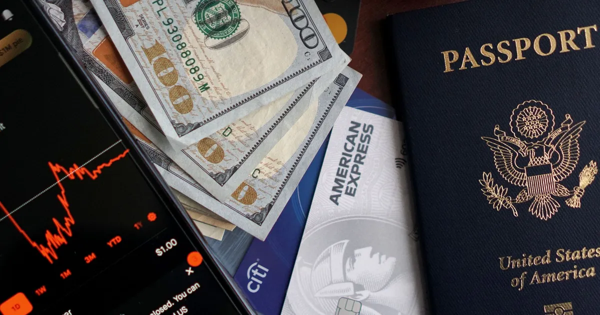 Stock trading concepts with passport, credit cards, cash, and smartphone app image.